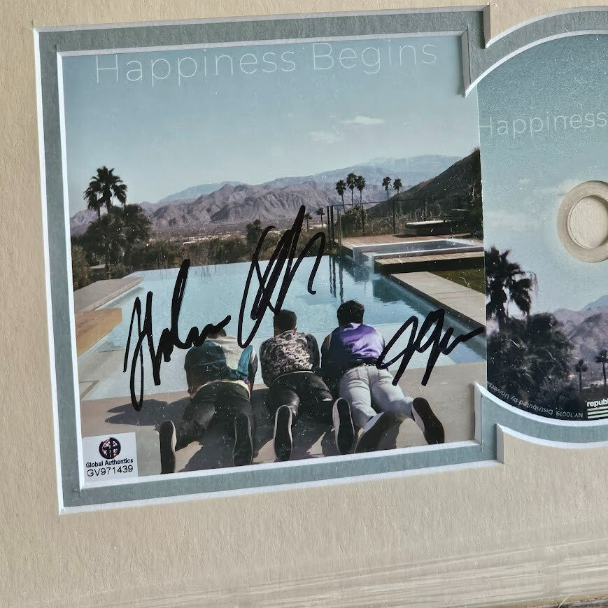 Jonas Brothers Band  autographed Signed Happiness Begins  Global Authentics COA